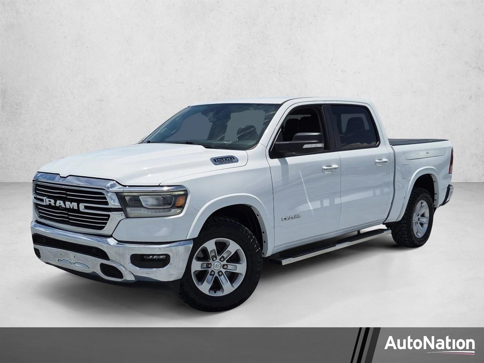 2020 RAM 1500 Laramie Crew Cab 4x4 5'7" Box in White — front three-quarter view