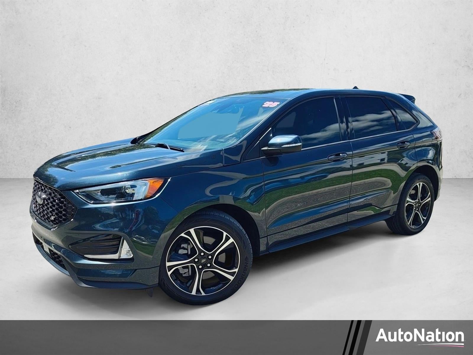 2023 Ford Edge ST AWD in Stone Blue Metallic — front three-quarter view